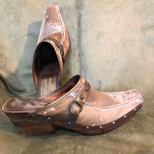 Cowhide wooden sole mules.